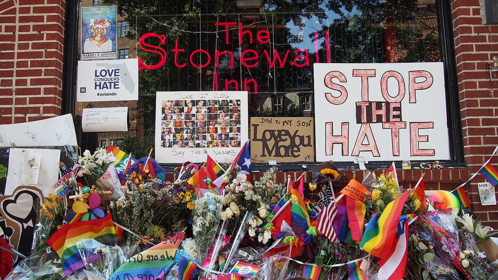 Image from outside Stonewall Inn of pride flags