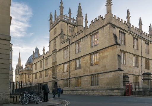 An Oxford building against a light blue sky.