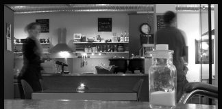 Black and white photo of a café counter