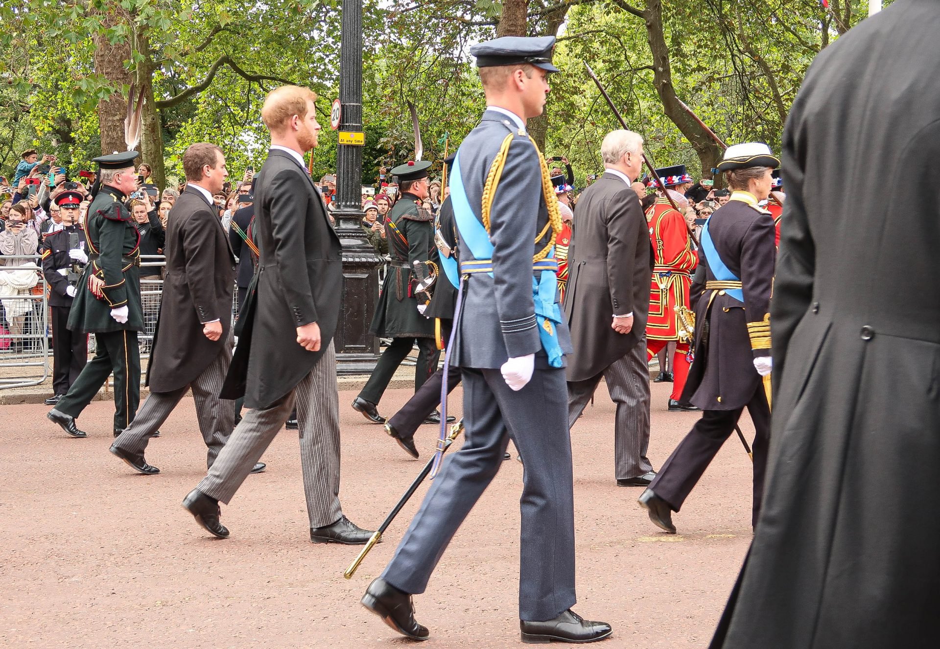 Members of the Royal Family walk in the procession following Queen Elizabeth II's funeral. Prince Harry is the second from the left.