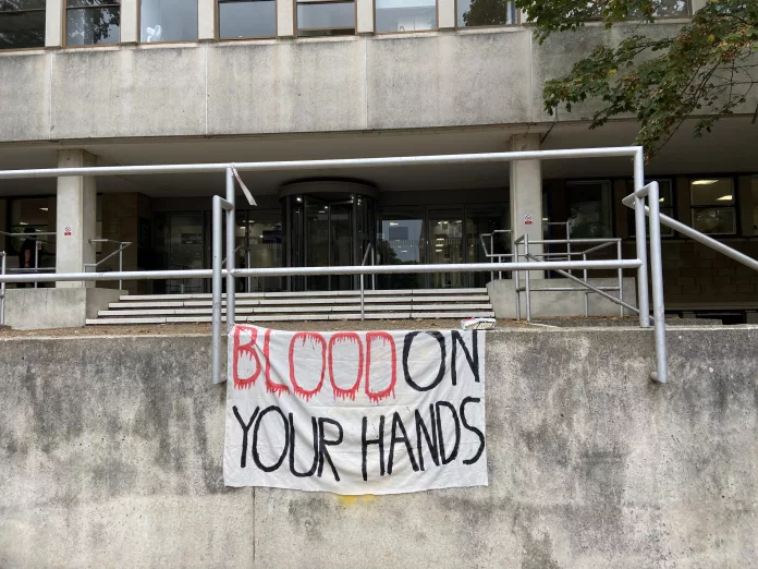 Banner used at the protest saying "blood on your hands"