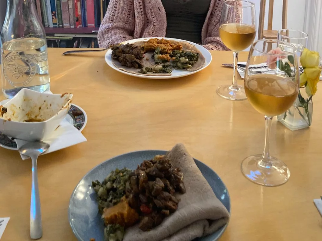 image of food and two glasses of wine at the restaurant