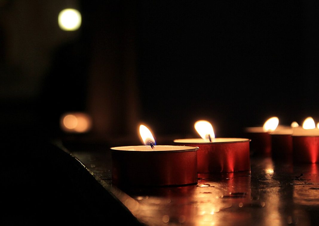 Candles lit in a cathedral