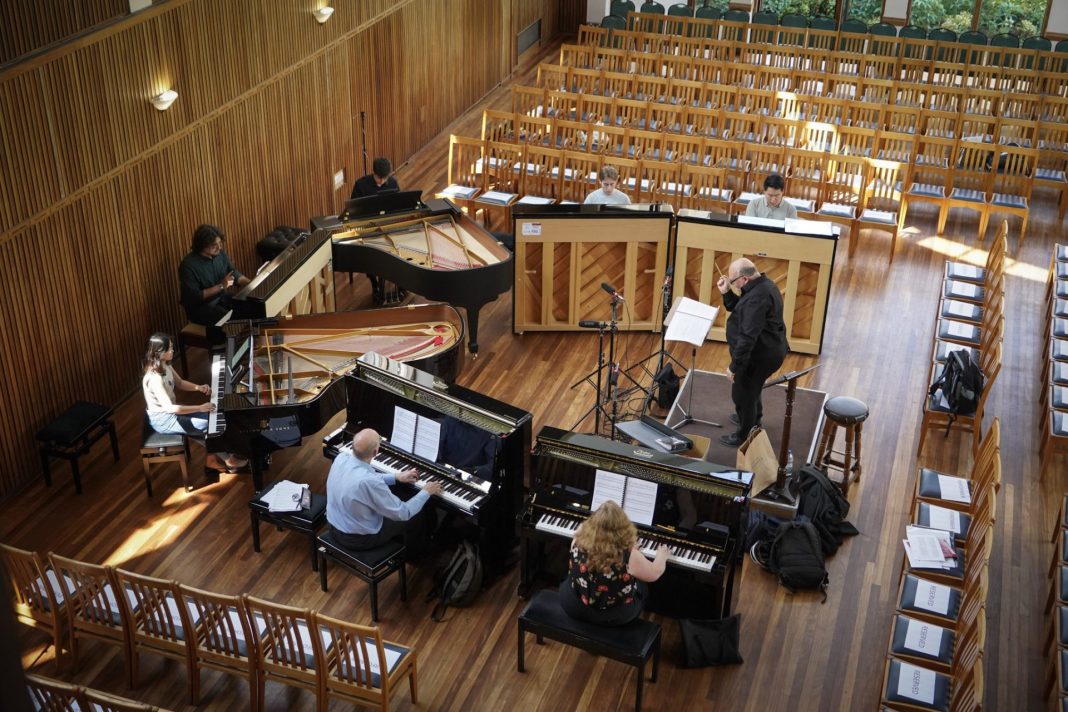 Seven new Steinway pianos are tested in a rehearsal room in St Anne's College, Oxford.