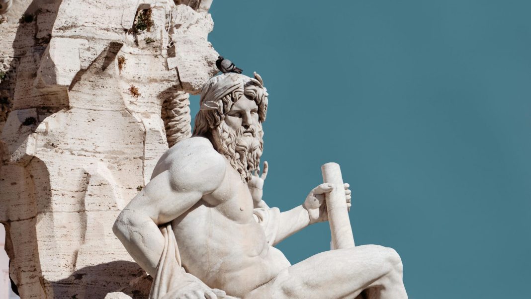 Sunlit Sculpture of a Greek God in Fontanna dei Quattro Fiumi