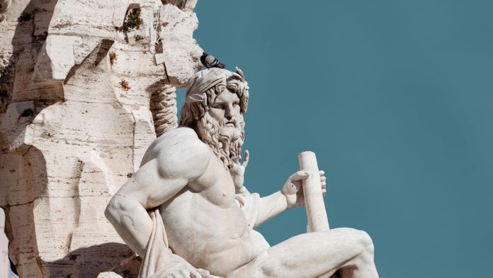 Sunlit Sculpture of a Greek God in Fontanna dei Quattro Fiumi